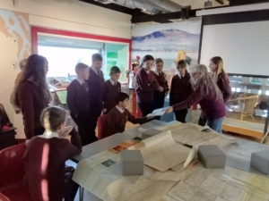 pupils looking at old maps